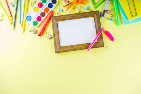 Colorful back to school background. Bright background with school supplies, stationery, pens, pencils, rulers, notebooks, copy space for text, whiteboard for notes, flat lay top viewの写真素材