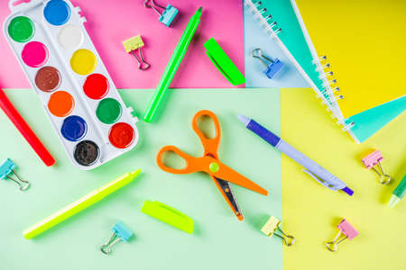 Colorful back to school background. Bright background with school supplies, stationery, pens,...