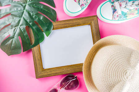 Summer sale shopping concept, Colorful background with various bright color children's women's clothes, glasses, sneakers, hat. Copy space flat lay, for banners, top viewの写真素材
