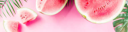 Creative watermelon layout. Summer trendy bright pattern with sliced watermelon and tropical leaves,...