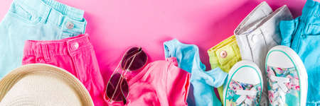 Summer sale shopping concept, Colorful  with various bright color children's women's clothes, glasses, sneakers, hat.の写真素材