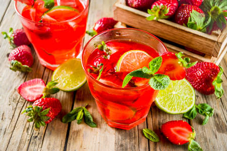 Homemade strawberry lemonade with lime and mint, rustic wooden  copy spaceの写真素材