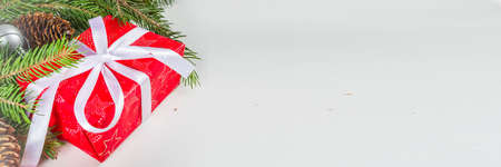 Christmas greeting card background with fir tree and decoration, white table background flat lay top view copy spaceの写真素材