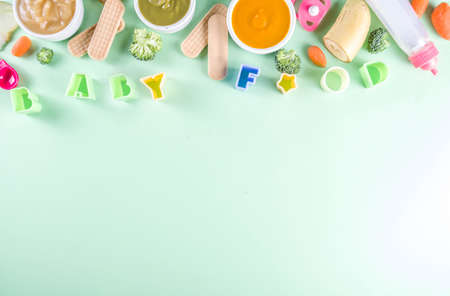 Infant baby food. Bowls with vegetable fruit puree, green, orange, yellow colorsの写真素材