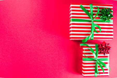 Christmas gift boxes simple pattern background. Festive boxes with Christmas presents, decorated...