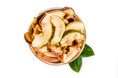 Heap of sun dried apple slices isolated on white background. Top viewの写真素材