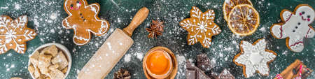 Christmas, New Year cooking background. Baking ingredients and utensils - flour, rolling pin, gingerbread, milk, eggs. Making festive Christmas sweet cookies. Top view copy spaceの写真素材