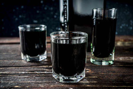 Finnish traditional alcohol. Winter warming drinks. Salmiakkikossu shot. Salmiakki koskenkorva cocktailの写真素材