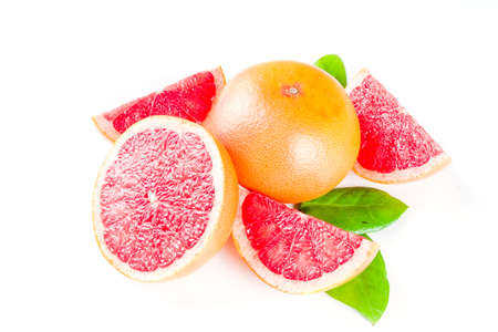 Whole and sliced grapefruit isolated on white background