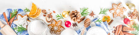 Christmas baking background. Christmas sweet cooking ingredients on white table. Ingredient for...