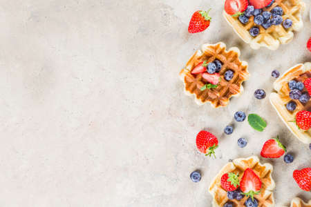 Sweet Homemade Breakfast Belgian Waffles with Berries - Strawberry and Blueberry 