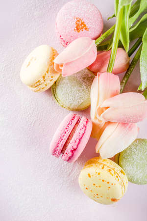 Classic colorful macarons. Six pink, yellow and green macaron cookies top view copy spaceの写真素材