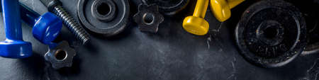 Sport and fitness concept background with dumbbells. Weight Training Equipment. Top view with space...