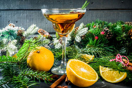 Christmas winter alcohol cocktail , with orange, rosemary and spicesの写真素材