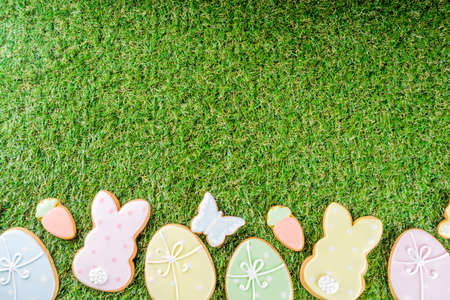 Sweet Easter baking cooking background with traditional Easter bunny and egg cookies, sugar...