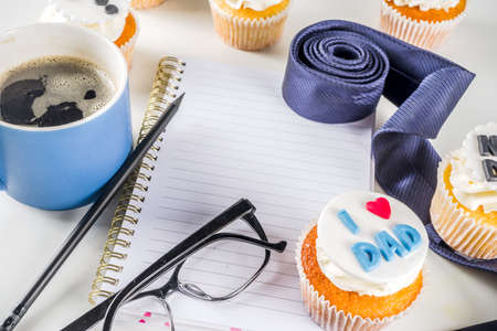 Happy Fatherâs Day greeting card.  Greetings and presents for Dad's day - gift box, coffee tea cup, tie, homemade special cupcakes. の写真素材