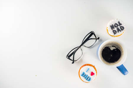 Happy Fatherâs Day greeting card.  Greetings and presents for Dad's day - gift box, coffee tea cup, tie, homemade special cupcakes. の写真素材