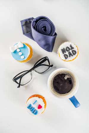 Happy Fatherâs Day greeting card.  Greetings and presents for Dad's day - gift box, coffee tea cup, tie, homemade special cupcakes. の写真素材