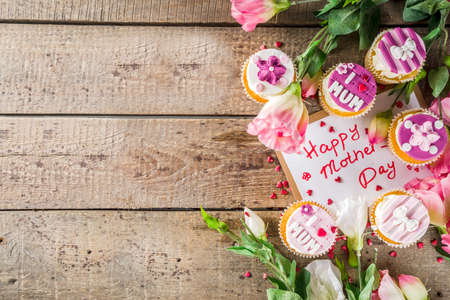 Happy moms day greeting background. Mothers day sweet cupcakes, with gift boxes, coffee cappuccino...