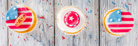 Independence Day July 4 congratulations background. Veterans Day. American Constitution holiday. USA American tradition greeting card. Patriotic home cupcakes with americas symbols decorの写真素材