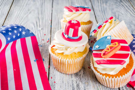 Independence Day July 4 congratulations background. Veterans Day. American Constitution holiday. USA American tradition greeting card. Patriotic home cupcakes with americas symbols decorの写真素材