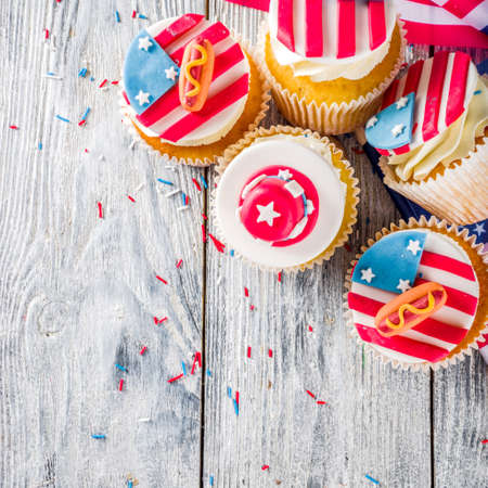Independence Day July 4 congratulations background. Veterans Day. American Constitution holiday. USA American tradition greeting card. Patriotic home cupcakes with americas symbols decorの写真素材