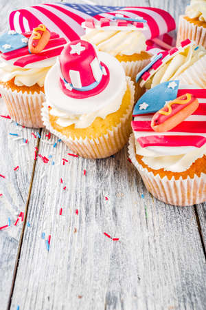 Independence Day July 4 congratulations background. Veterans Day. American Constitution holiday. USA American tradition greeting card. Patriotic home cupcakes with americas symbols decorの写真素材