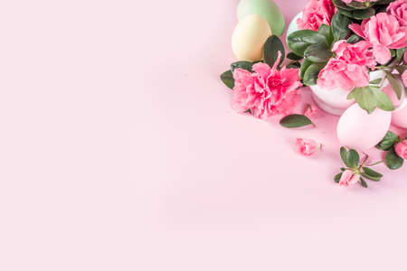 Tender Easter composition with easter eggs and pink spring flower branches