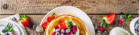 Sweet french and russian style homemade pancake crepes. Layered crepe cake with whipped cream or mascarpone cheese and fresh berriesの写真素材