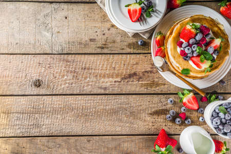 Sweet french and russian style homemade pancake crepes. Layered crepe cake with whipped cream or mascarpone cheese and fresh berriesの写真素材