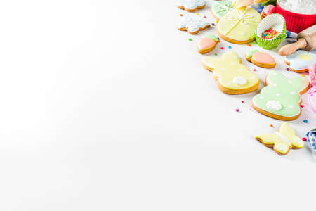 Sweet Easter baking cooking background with traditional Easter bunny and egg cookies, sugar...