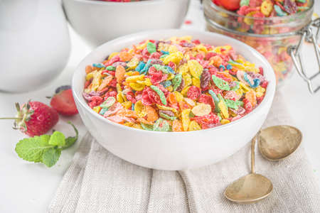 Colorful fruit cereal flakes. Multicolored fruit breakfast corn flakes, with various fruit taste,...