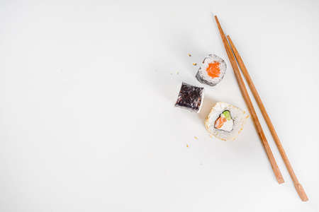 Japanese food. Big sushi set. Assorted set of various sashimi, maki and sushi rolls with different fillings - tuna, sea bass, salmon, shrimp, vegetables. Flatlay copy spaceの写真素材
