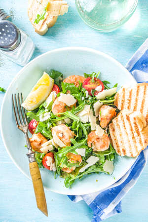 Healthy food concept, Diet salad plate. Fresh seafood salad recipe. Grilled shrimp prawns, fresh vegetable salad and egg. の写真素材