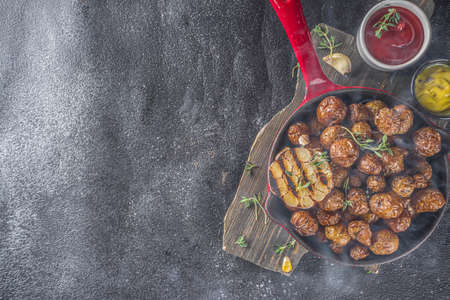 Baked in frying pan whole young potatoes, homemade bbq vegetarian food