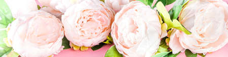Floral peonies arrangement . Artificial tender white pinkish peony flower with leaves, flat composition on a light background. top view place for textの写真素材
