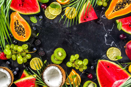 Assorted different summer tropical fresh raw fruits and berries. Clean eating, healthy lifestyle,...