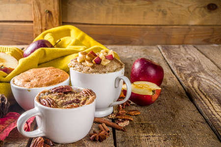 Fall and winter sweet dessert.  Traditional Autumn Cakes, Microwave Mug Pies -  Mug Pumpkin Pie, Apple Crumble Crisp Pie, Pecan Mug Cakeの写真素材
