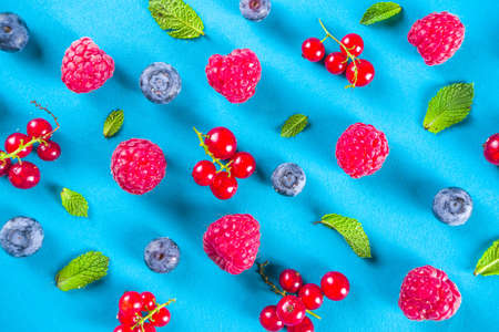 Various summer berry pattern on blue background, flatlay top view の写真素材