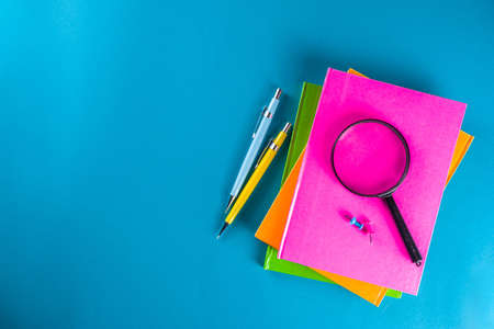 Back to school, education background. Back to School Blue Background with School Bag Backpack, Notebook, Pen, Pencil, Pencils, Magnifying Glass, Eraser, Paper Clip, Alarm Clock, School Supplies の写真素材