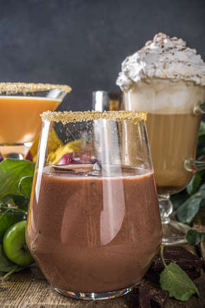 Various autumn winter alcohol cocktail set. Traditional fall alcoholic hot and iced drink in...