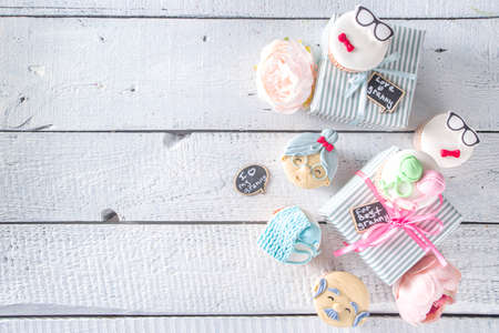 Grandparents Day holiday concept, Grandmother and Grandfather Day greeting background. Sweet homemade cupcakes for grandma and grandpa, with I love you Granny text inscription. With gifts and flowersの写真素材