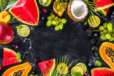 Assorted different summer tropical fresh raw fruits and berries. Clean eating, healthy lifestyle,...