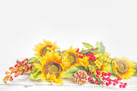 Festive autumn background, still life decor with pumpkins, berries, leaves on white wooden background. Concept background for Thanksgiving or Halloween holiday, copy space, flatlayの写真素材