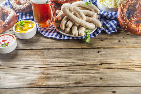 Bavarian German holiday traditions. Oktoberfest food and beer glass mug. Background for congratulations with Oktoberfest, autumn restaurant menu.の写真素材