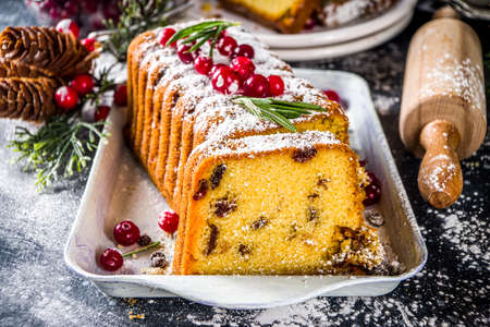 Traditional christmas baking, Festive Xmas fruitcake with dryed fruits, liquer, and cranberry decor....