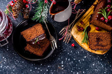 Chocolate Gingerbread Cake on festive background. Traditional Gingerbread cake with dark chocolate...