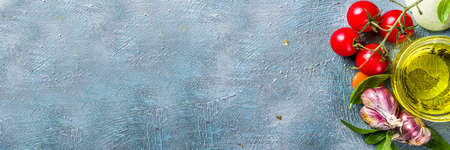 Food cooking background. Spices, vegetables and herbs on concrete background. Top viewの写真素材