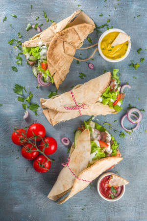 Turkish kebab wrap shawarma sandwiches. Tasty fresh wrap sandwiches with beef meat and vegetables, Traditional Middle Eastern snack.の写真素材