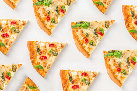 Various italian american traditional pizza slices. Slices of delicious pizza on light background,...